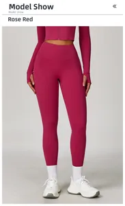 Detail of rose red yoga set featuring long sleeve zip crop top with thumbholes and leggings