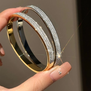 Elegant gold and silver plated bracelets with four rows of sparkling rhinestones