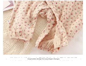 Detail of snap buttons on floral baby romper made of soft cotton double gauze fabric