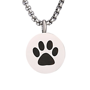 Polished silver stainless steel round pet urn necklace with a black paw print pendant