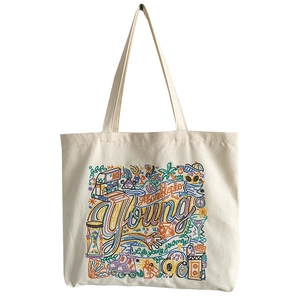 White canvas tote bag with colorful American vintage embroidery and artistic text