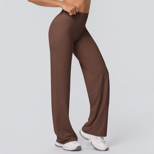 Detail view of high waisted flared yoga pants in dark brown fabric showing side profile