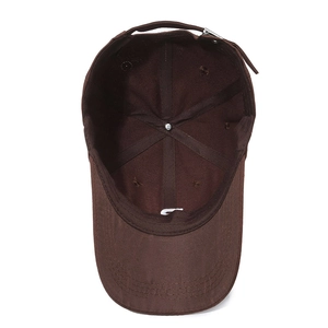 Dark brown cotton baseball cap showing internal stitching and adjustable metal buckle