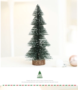 Mini Christmas tree with snow-tipped pine needles and natural rustic wood base