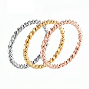 Three-piece stackable braided twist rings set in silver, gold and rose gold stainless steel