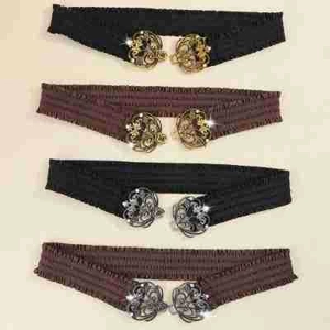 Elastic waist belts in black and brown with ornate cutout buckles in gold and silver
