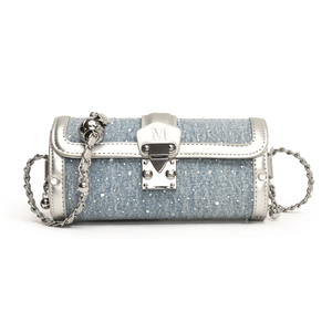 Fashionable denim blue cylinder shoulder bag with silver chain strap and metal buckle