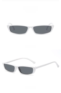 Detail view of retro rectangle white frame sunglasses with grey lenses in dual angles