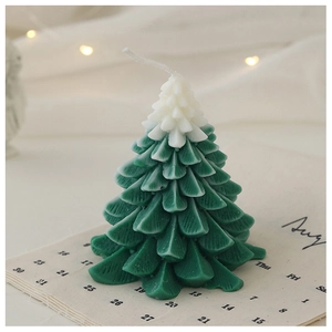 Detailed view of bicolor Christmas tree scented candle with white top and green base