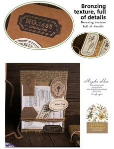 Detail of vintage gold-stamped stickers with floral motifs and geometric labels on old paper