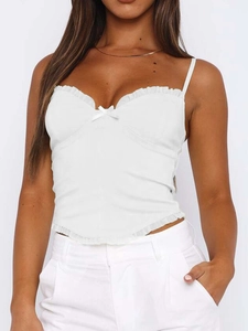 Detail of white Y2K corset top featuring ruffle trim and delicate front bow detail