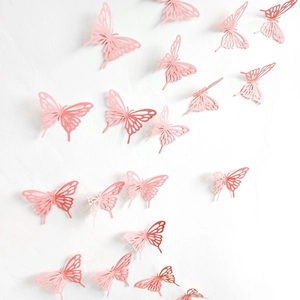 Detailed view of pink 3D hollow butterfly wall stickers with various sizes and patterns