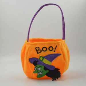 Orange Halloween treat bag with purple handle and green witch embroidery featuring Boo text