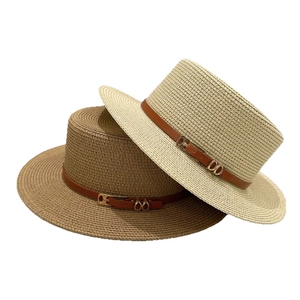 French vintage straw boater hats with wide brims and leather bands in white and brown