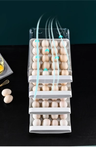 Detail of four-tier clear stackable egg storage drawer with white food-grade PP trays