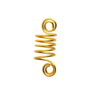 Close-up of golden spiral hair coil rings for dreadlocks and DIY hair accessories set