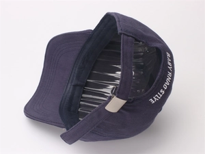 Detail view of the navy blue cotton baseball cap back with metal buckle and embroidery
