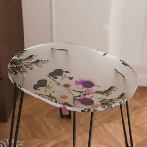 Detailed view of oval tray mold featuring colorful floral patterns on a matte surface