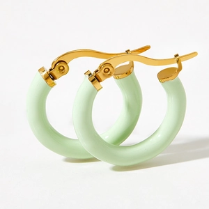 Minimalist gold hoop earrings with mint green enamel coating for a modern fresh look