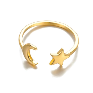 Detailed view of adjustable golden star and moon ring with polished metallic finish