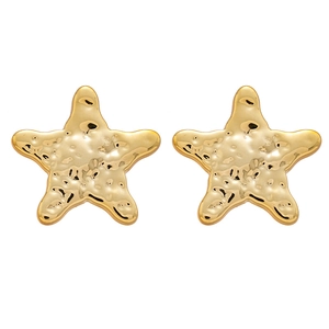 Minimalist gold starfish stud earrings with a textured hammered metallic surface on white back