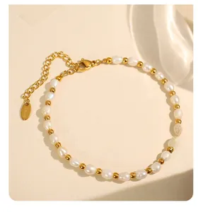 Detailed macro view of baroque freshwater pearl bracelet with gold stainless steel clasp