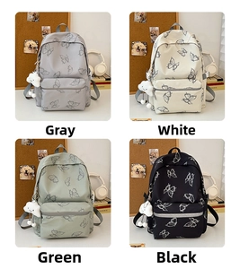 Detailed view of large capacity butterfly backpacks in grey, white, green and black colors