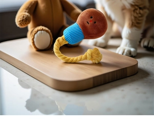 Detail of plush squeaky dog toy with durable cotton rope for pet chewing and interactive play