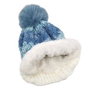 Winter knit hat for kids with gradient blue color, thick fleece lining, and fluffy pom-pom
