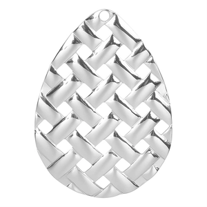 Macro detail of silver teardrop pendant with intricate woven texture and high metallic gloss