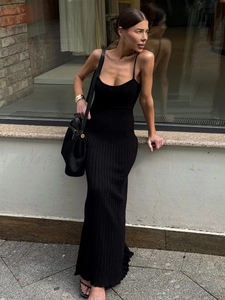 Slim fit black ribbed knit maxi dress with spaghetti straps and fishtail hem for summer
