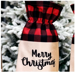 Detail of Christmas wine bottle bag with red plaid and Merry Christmas print