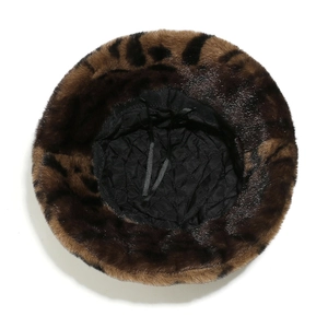Detailed top view showing black quilted lining and adjustable drawstring of leopard fur hat
