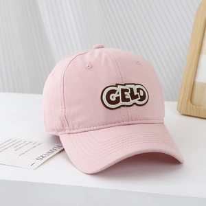 Pink cotton baseball cap for kids with GELD embroidered patch and curved brim for sun protection