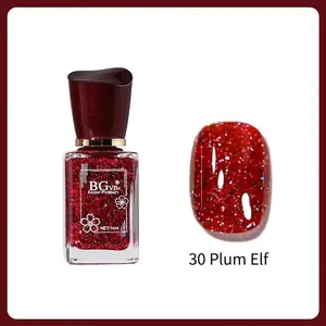 Macro view of BG306 plum red glitter nail polish bottle and painted oval tip 14ml