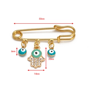 Detailed view of evil eye brooch with Fatima hand pendants and precise size markings