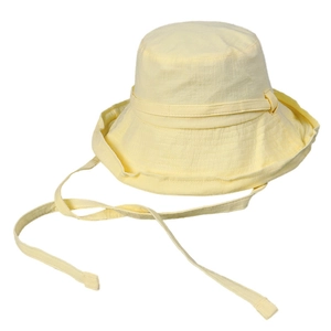Pale yellow cotton bucket hat for women with adjustable drawstring and wide sun brim