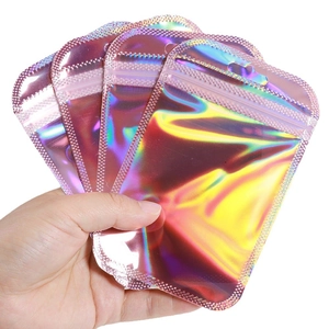 Iridescent laser self-sealing bags for jewelry packaging held in hand on white background