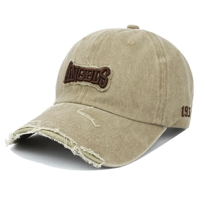 Detailed macro view of vintage distressed baseball cap with ANGELS 3D embroidery