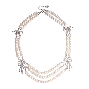 Elegant multi-layer pearl necklace featuring a sparkling rhinestone bow and silver clasp