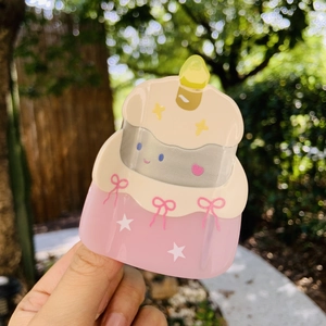 Cute acetate cake-shaped hair claw clip with a pink bow and golden candle detail