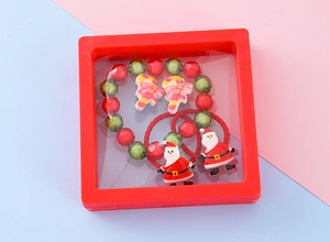 Christmas jewelry set including Santa hair ties and beaded bracelet in a red frame box