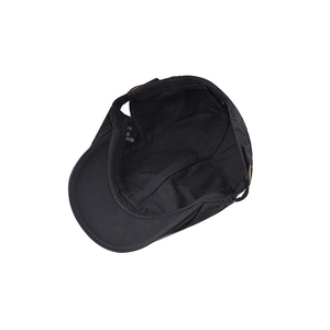 Detail view of cotton flat cap interior with sweatband and fine stitching craftsmanship