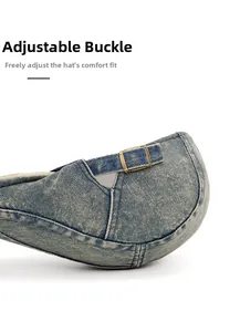 Detail of adjustable brass metal buckle and washed denim strap on back of the hat