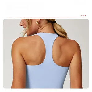 Close-up of racerback design on light blue yoga tank top showing smooth seamless fabric
