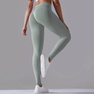 Detail of high-waist seamless yoga pants showing the peach lift and tummy control design