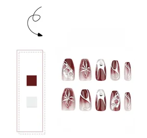 Detailed view of burgundy and cream gradient press-on nails with silver flame patterns