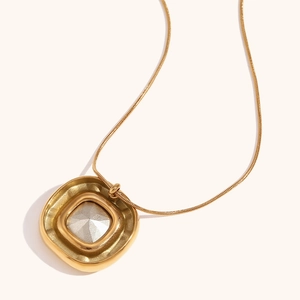 Detailed close-up of a square flower pendant necklace in 18K gold and silver plating