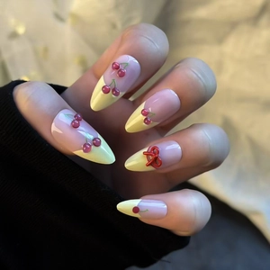 French press-on nails with 3D cherry and red bow designs on long almond tips