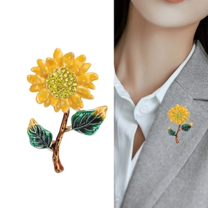 Elegant sunflower brooch with yellow petals and crystals, shown on model and white background